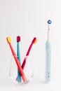 Manual Regular Toothbrush Against Modern Electric Toothbrush