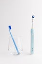 Manual Regular Toothbrush Against Modern Electric Toothbrush