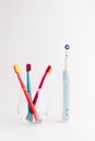 Manual Regular Toothbrush Against Modern Electric Toothbrush