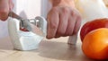 Manual sharpening of a knife in a special sharpener Royalty Free Stock Photo