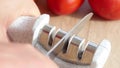 Manual sharpening of a knife in a special sharpener Royalty Free Stock Photo