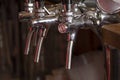 Manual tap pump for filling beer in the bar behind the bar counter. Royalty Free Stock Photo