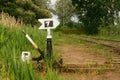 Manual transfer path Arrow Railway bridge over the river overgrown summer