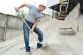 manual worker digging sand with shovel Royalty Free Stock Photo