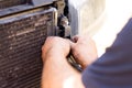 Dismantling broken car radiator to fix problem
