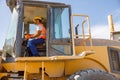 Manual worker driving cargo truck in plant Royalty Free Stock Photo