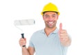 Manual worker with paint roller gesturing thumbs up