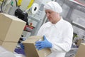 Manual worker at production line dealing with boxe Royalty Free Stock Photo