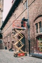 Manual Worker standing on a scissor lift Royalty Free Stock Photo