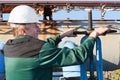 Manual worker turning big valve Royalty Free Stock Photo