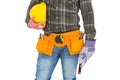 Manual worker wearing tool belt while holding gloves and helmet Royalty Free Stock Photo