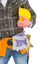 Manual worker wearing tool belt while holding helmet Royalty Free Stock Photo