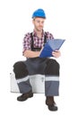 Manual Worker Writing On Clipboard Over White Background Royalty Free Stock Photo