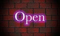 Manually created illustration of a brick wall with the word open in neon