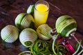 Manually peeling fresh ripe green oranges for orange juice with a manual vintage orange and apple peeler