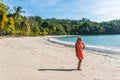 Manuel Antonio, Costa Rica - Girl walking at beautiful tropical beach