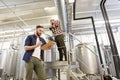 Men with clipboard at brewery or beer plant Royalty Free Stock Photo