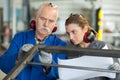 Manufacture workers working on electronic machine Royalty Free Stock Photo