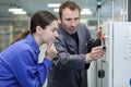 manufacture workers working on electronic machine Royalty Free Stock Photo