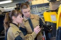 manufacture workers working on electronic machine Royalty Free Stock Photo