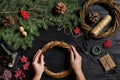 Manufacturer of Christmas decor with their own hands. Christmas wreath for the holiday. The new year celebration. Top Royalty Free Stock Photo