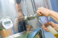 manufacturer filling beer from storage tank Royalty Free Stock Photo