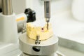 Manufacturing of dental crowns and dentures