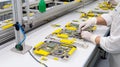 Manufacturing in a High-Tech Factory, Technician Assembling Communication Device, Generative AI