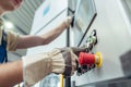 Manufacturing worker pressing button of metal bending machine Royalty Free Stock Photo