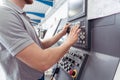 Manufacturing worker programming industrial CNC machine tool Royalty Free Stock Photo