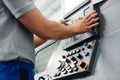 Manufacturing worker programming industrial CNC machine tool Royalty Free Stock Photo