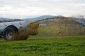 Manure is spread on meadow Royalty Free Stock Photo