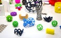 Many abstract models printed by 3d printer close-up.