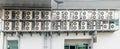 Many air conditioners units compressor are attached to the sides of large buildings Royalty Free Stock Photo