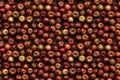 Many apples lie on a wooden table, concept of Abundance, seamless pattern created with Generative AI technology