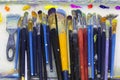 many art brushes lie on the palette, paints Royalty Free Stock Photo