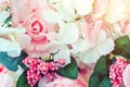 Many artificial pink and white roses are decorated on the glass door to the backdrop in the afternoon. Beautiful flowers Royalty Free Stock Photo