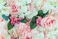 Many artificial pink and white roses are decorated on the glass door to the backdrop in the afternoon. Beautiful flowers Royalty Free Stock Photo