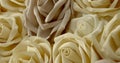 Many artificial roses are lying on table, detail view, moving shot