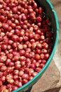 Many asian onion in green basket