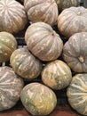 Many asian pumpkins fruits on the table.