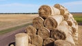 Many bales straw field. Many bales rolls wheat straw stacked together in field