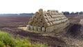 Many bales of straw field. Many bales rolls wheat straw stacked together field