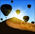 Many balloons flying up over the desert. Royalty Free Stock Photo