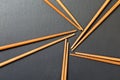 Many bamboo chopsticks on black slate background, textured, top view with opy space Royalty Free Stock Photo