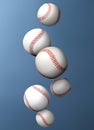 Many baseball balls falling on steel blue gradient background