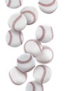 Many baseball balls falling on white background