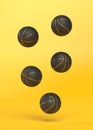 Many basketballs are falling on a bright yellow background with copy space