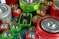 Many batteries of different types as background, closeup view