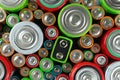 Many batteries of different types as background, top view